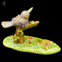 ENAMELED PERCHED BIRD