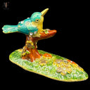 ENAMELED PERCHED BIRD